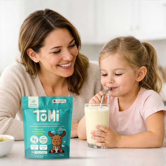 Mother and child enjoying a smoothie beside a bag of TOMI kids protein powder.