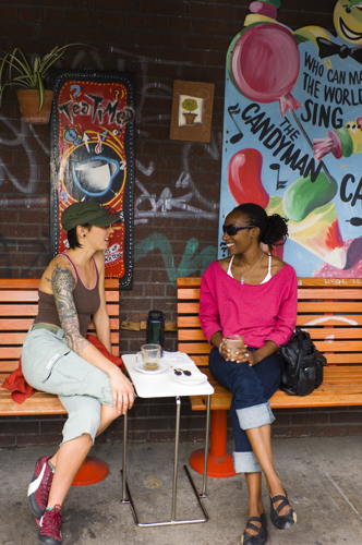 Two friends chatting at a Toronto café